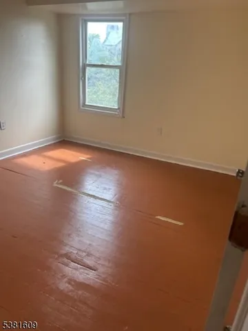 an empty room with an empty space and window