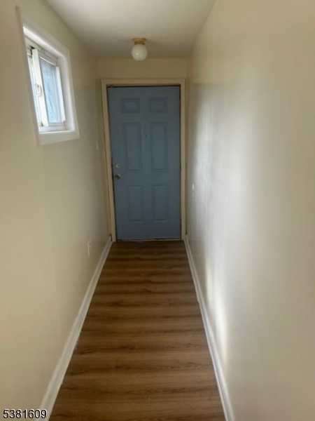 41 Myrtle Avenue Newark, NJ 07107 - Photo 9 of 10 a view of a hallway with wooden floor and entryway