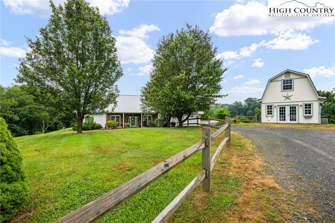 175 Olive Ridge Drive Crumpler, NC 28617 - Photo 2 of 50 a view of house with garden space and street view
