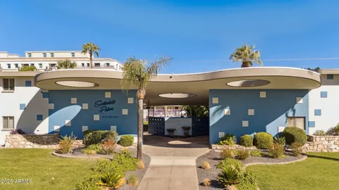 a kitchen with a dining table chairs sink and stove