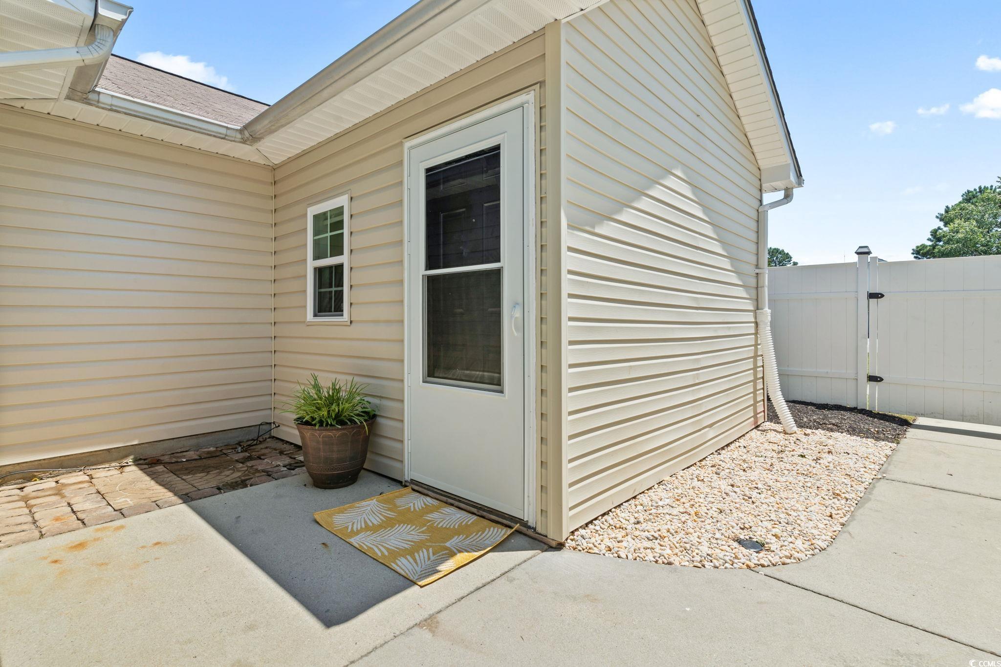 1007 Autumn Drive Murrells Inlet, SC 29576 - Photo 27 of 33 Property entrance with a patio and a gate