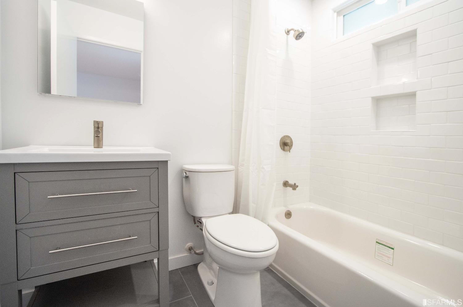 1253 Terra Nova Boulevard Pacifica, CA 94044 - Photo 12 of 23 a bathroom with a toilet a sink and bathtub