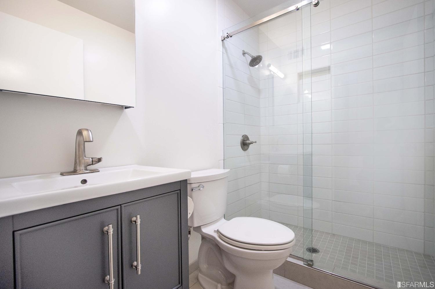 1253 Terra Nova Boulevard Pacifica, CA 94044 - Photo 14 of 23 a bathroom with a sink a toilet and shower
