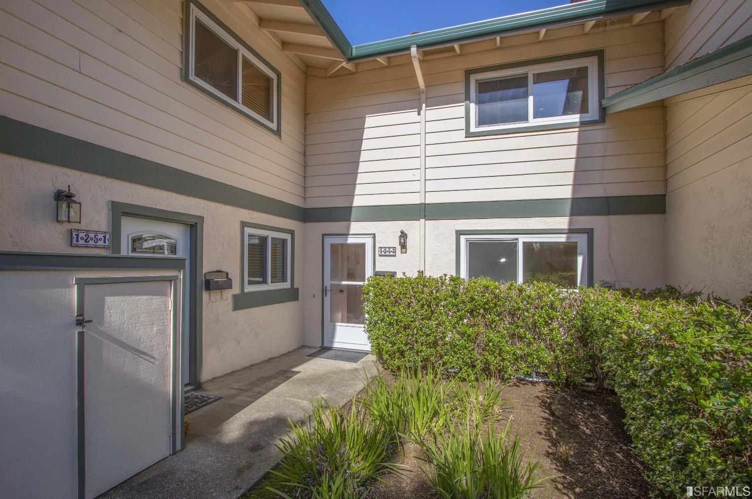 1253 Terra Nova Boulevard Pacifica, CA 94044 - Photo 20 of 23 a view of a house with a small yard and wooden floor and fence