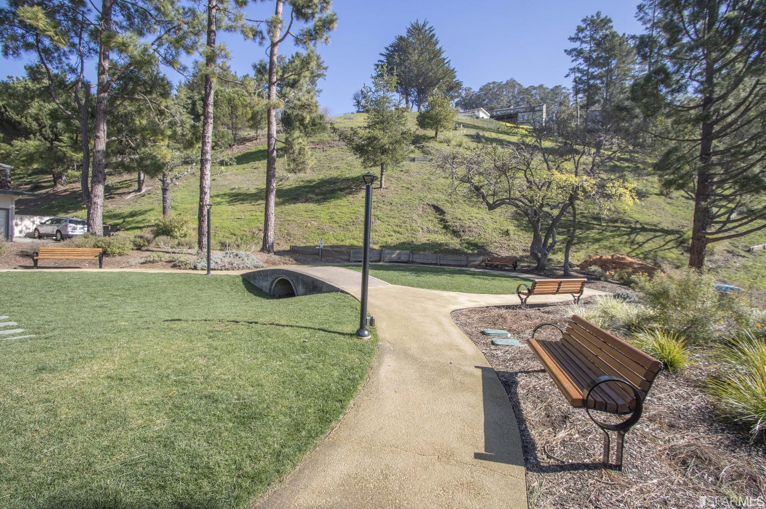 1253 Terra Nova Boulevard Pacifica, CA 94044 - Photo 21 of 23 a garden view with a seating space