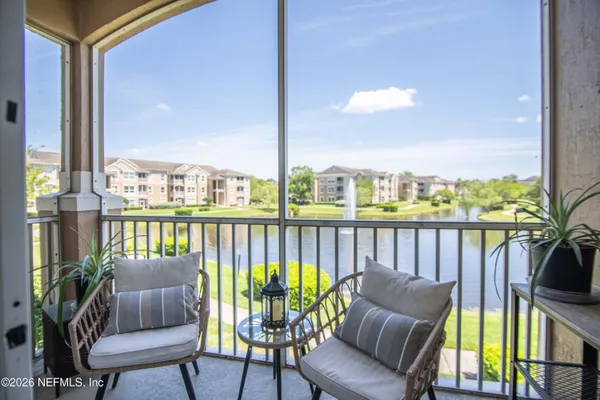 a balcony with wooden floor