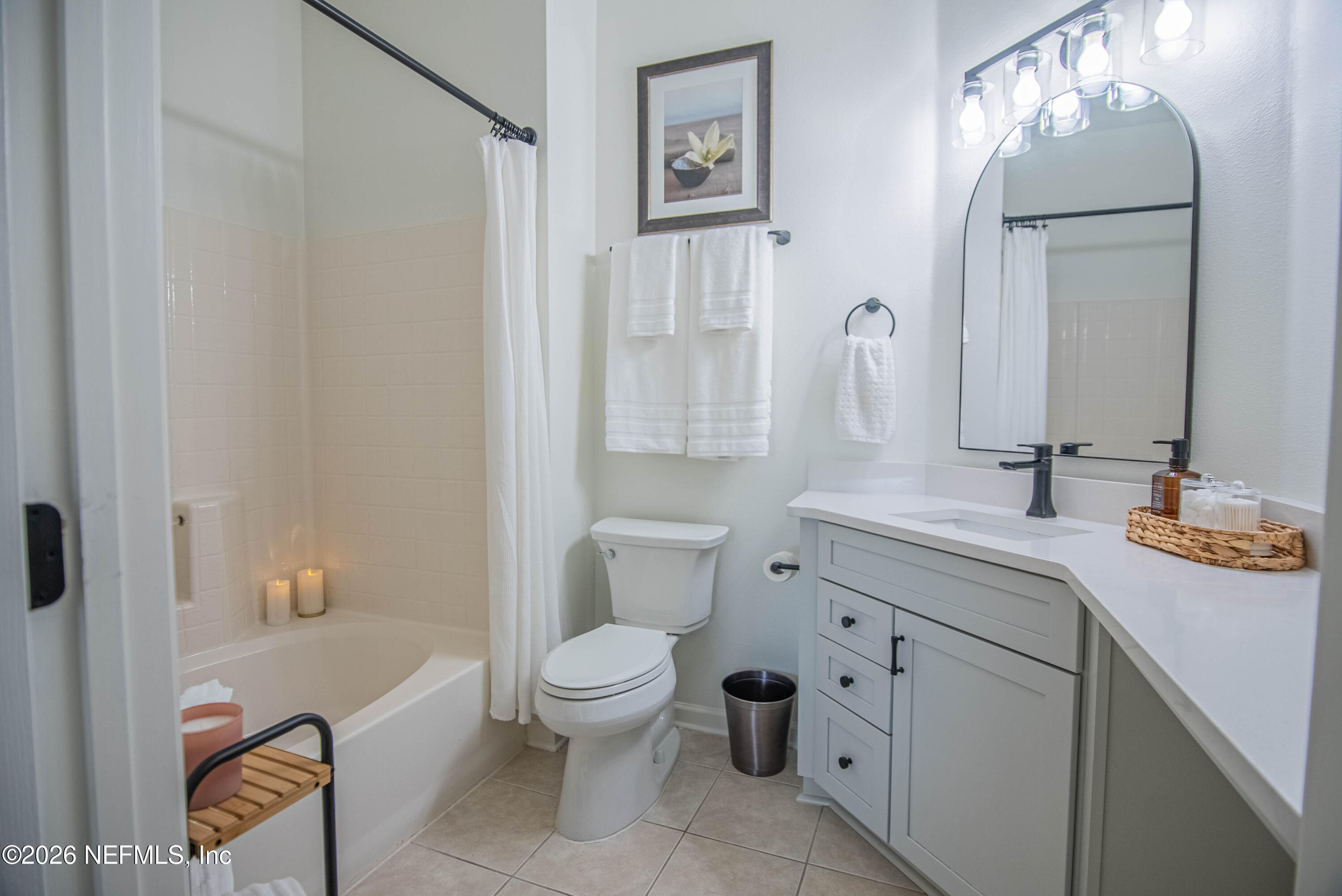 7990 Baymeadows Road East, Unit 823 Jacksonville, FL 32256 - Photo 17 of 45 a bathroom with a toilet sink and mirror
