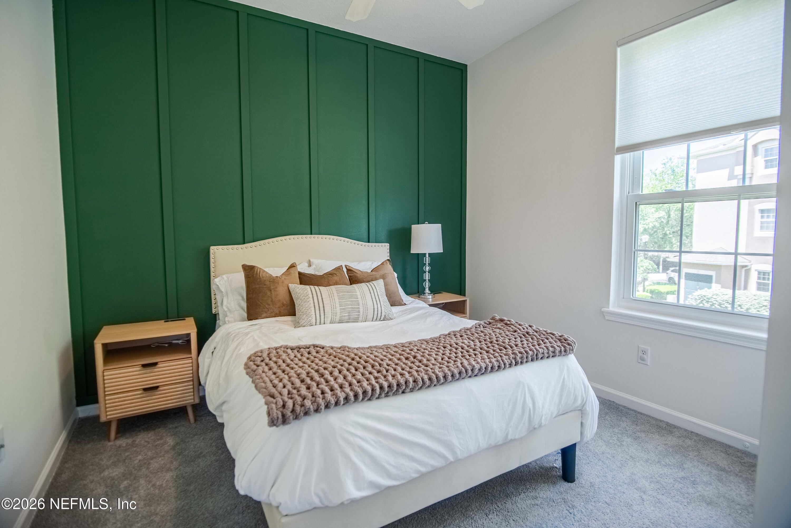 7990 Baymeadows Road East, Unit 823 Jacksonville, FL 32256 - Photo 22 of 45 a bedroom with a bed a window and closet