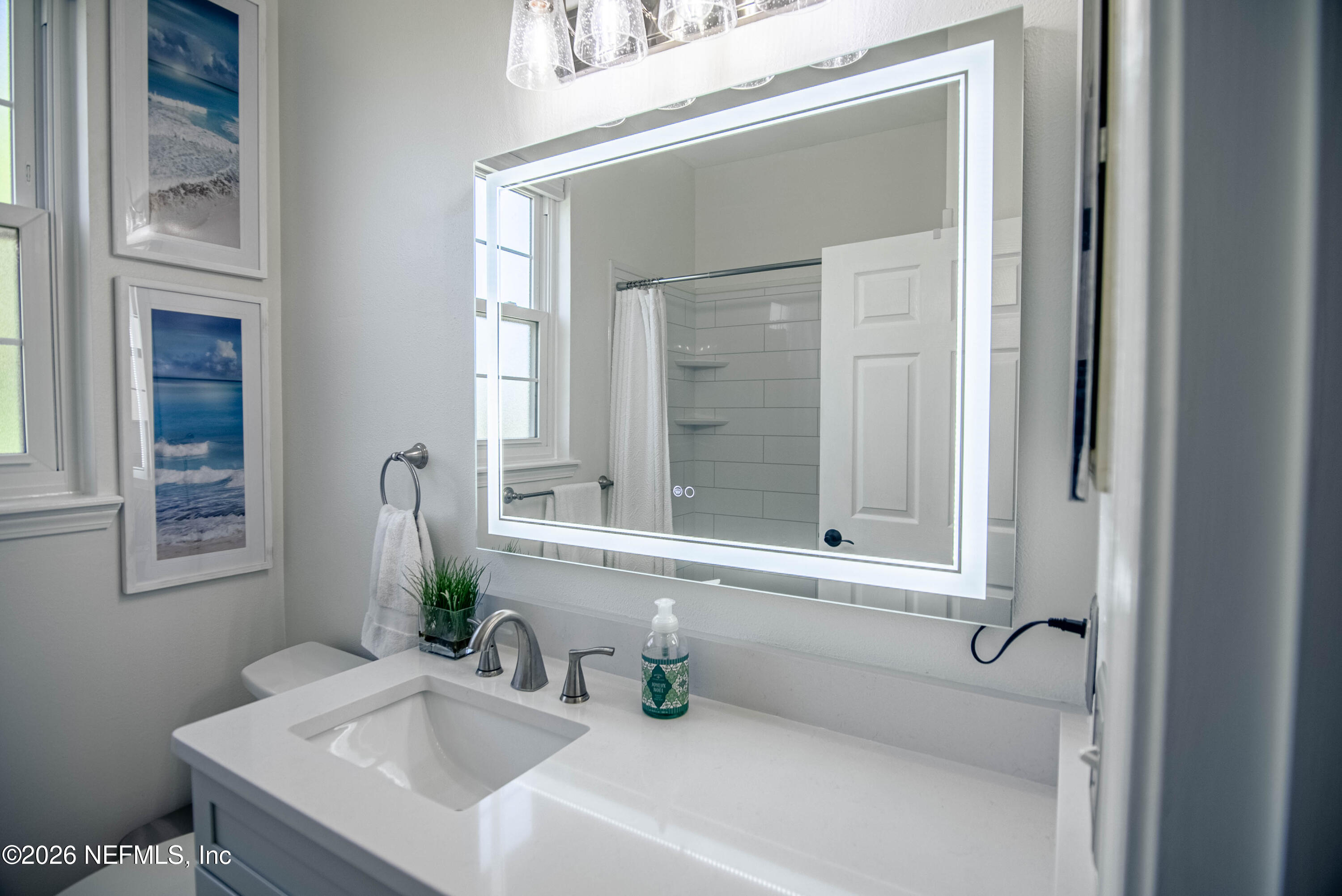 7990 Baymeadows Road East, Unit 823 Jacksonville, FL 32256 - Photo 25 of 45 a bathroom with a sink and a mirror