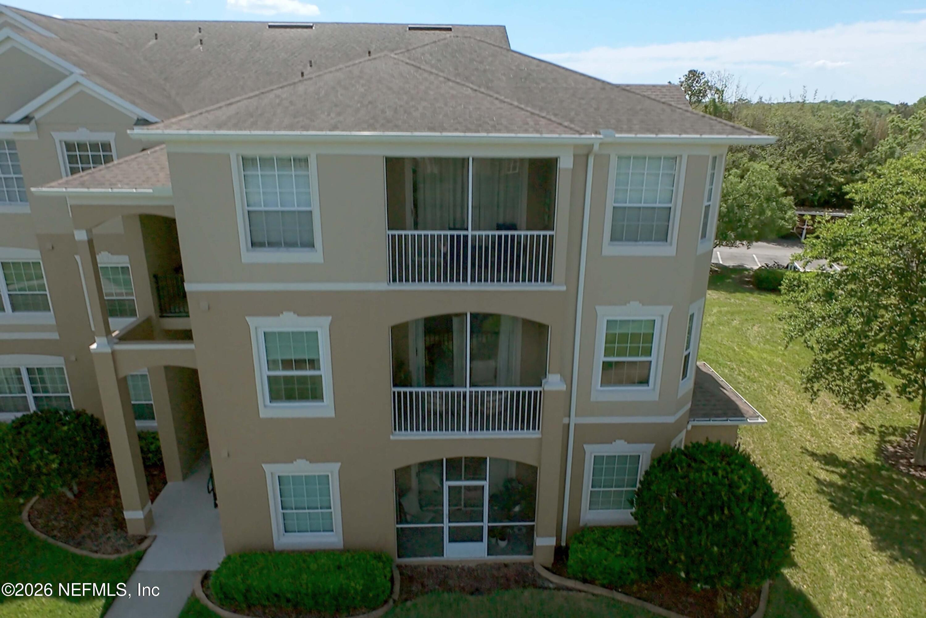 7990 Baymeadows Road East, Unit 823 Jacksonville, FL 32256 - Photo 33 of 45 a front view of a house with a yard