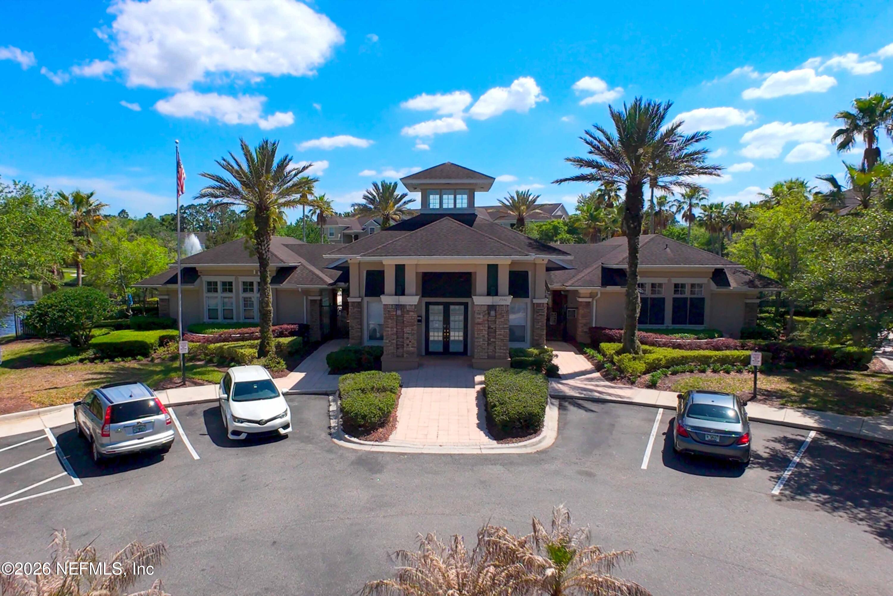 7990 Baymeadows Road East, Unit 823 Jacksonville, FL 32256 - Photo 35 of 45 a front view of a house with patio
