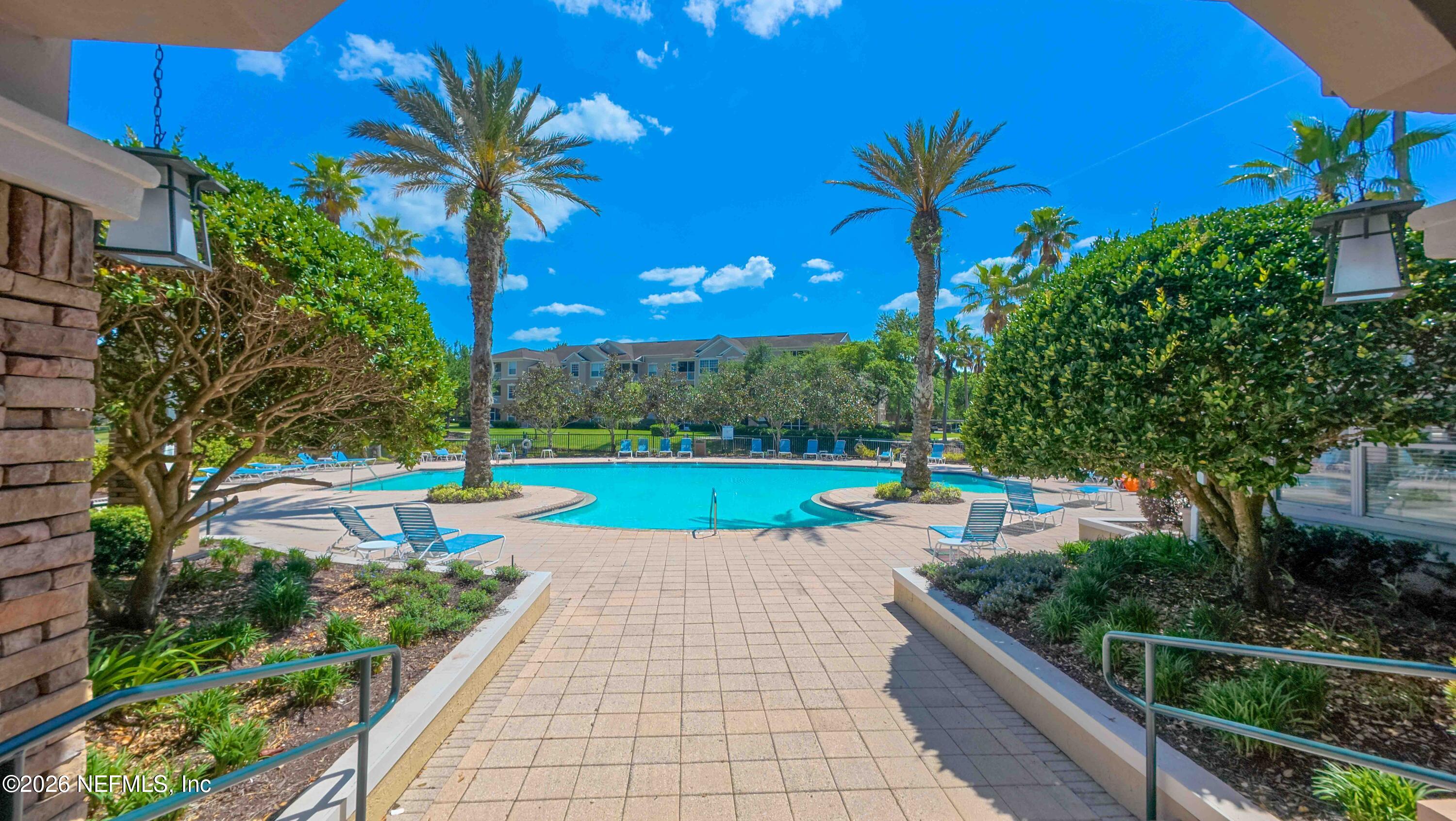 7990 Baymeadows Road East, Unit 823 Jacksonville, FL 32256 - Photo 38 of 45 a view of a garden with a slide