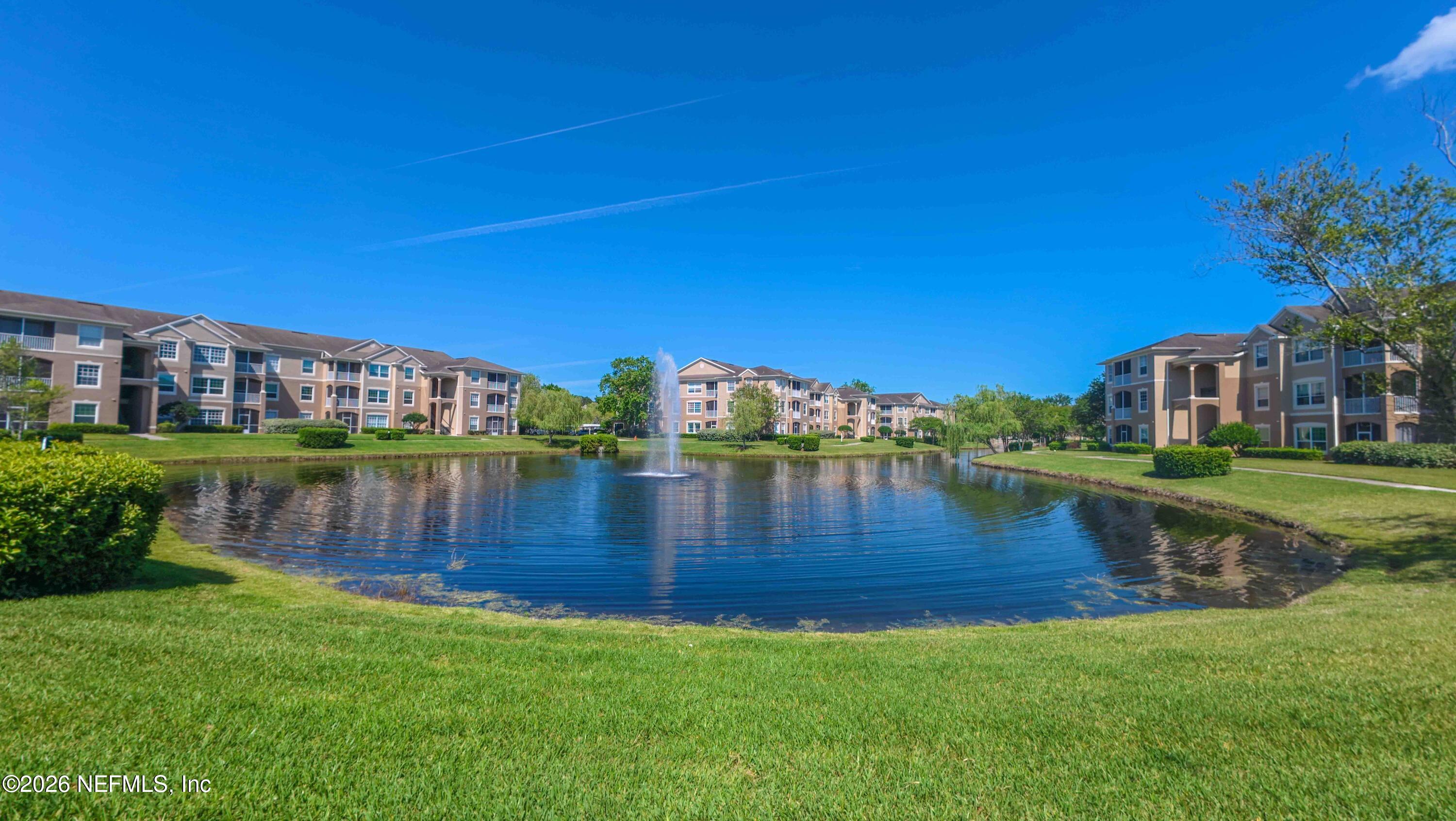 7990 Baymeadows Road East, Unit 823 Jacksonville, FL 32256 - Photo 40 of 45 a view of a lake with a house