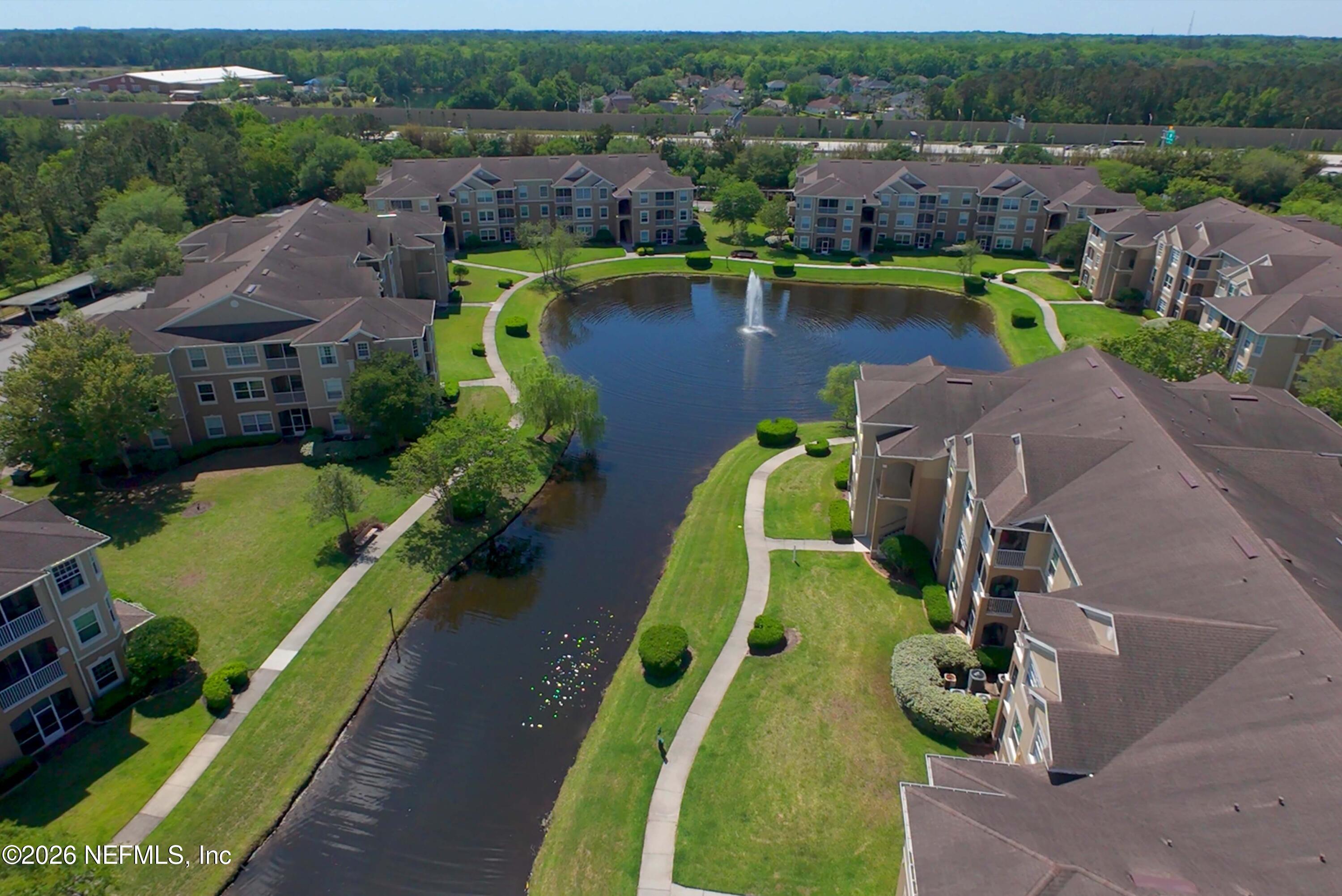 7990 Baymeadows Road East, Unit 823 Jacksonville, FL 32256 - Photo 44 of 45 an aerial view of a house with a swimming pool yard and outdoor seating