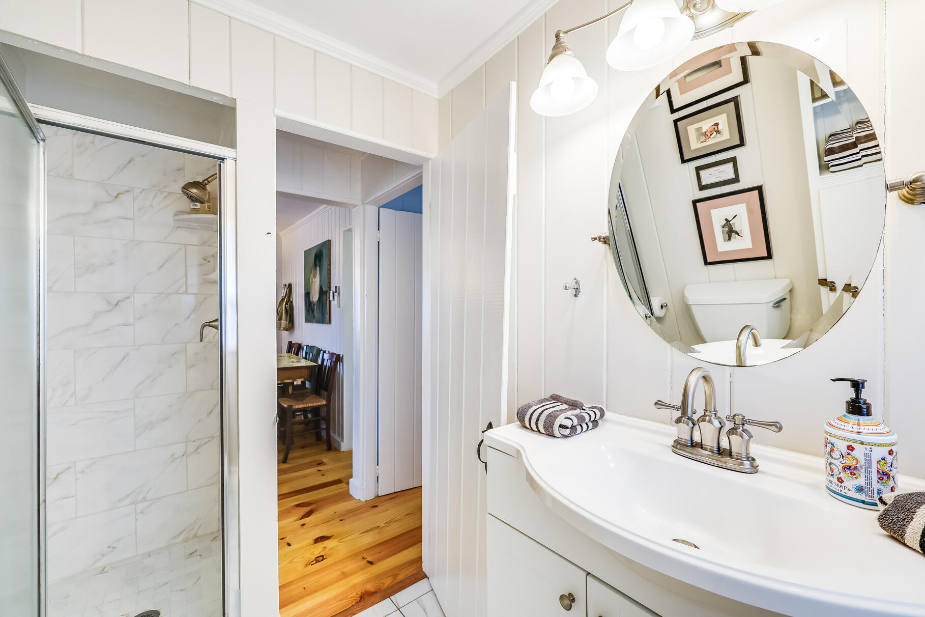 164 Kendrick Avenue, Unit B Wellfleet, MA 02667 - Photo 14 of 32 a bathroom with a sink and a mirror