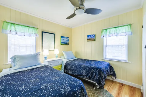 a spacious bedroom with a bed and a large window