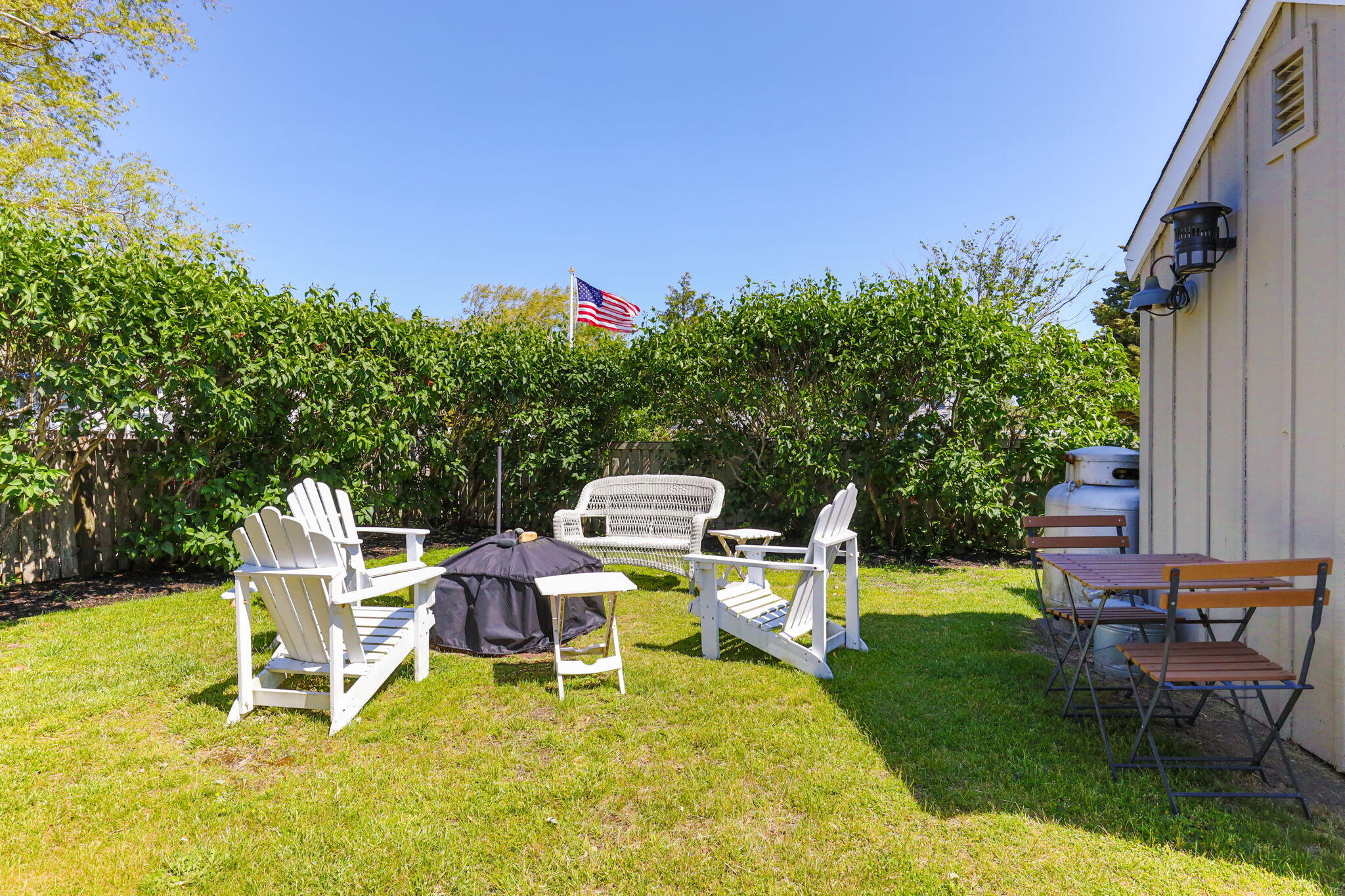 164 Kendrick Avenue, Unit B Wellfleet, MA 02667 - Photo 21 of 32 a view of a chairs and table in patio