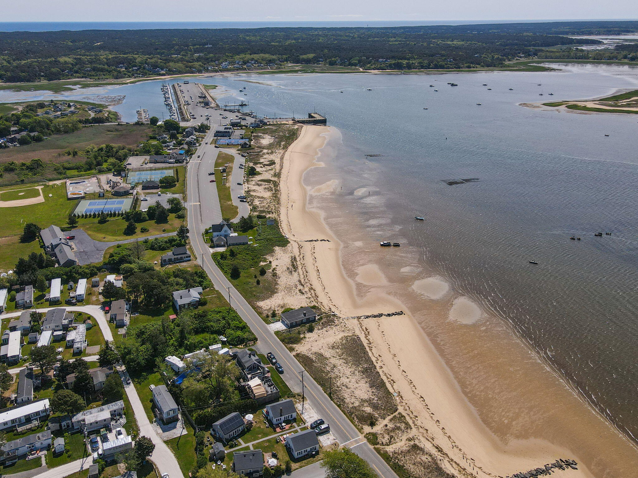 164 Kendrick Avenue, Unit B Wellfleet, MA 02667 - Photo 23 of 32 an aerial view of a house with a yard and ocean view