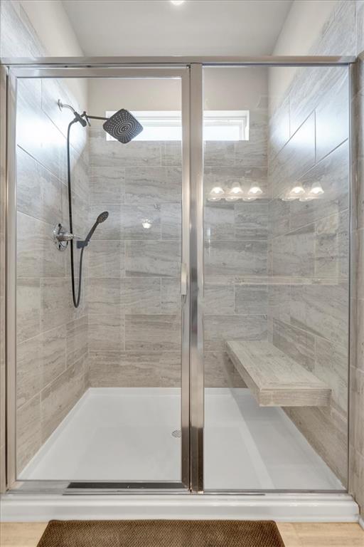 24 Jackson Farm Road Cartersville, GA 30120 - Photo 28 of 50 a bathroom with a glass shower door