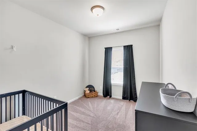 a bathroom with a toilet a sink and a mirror