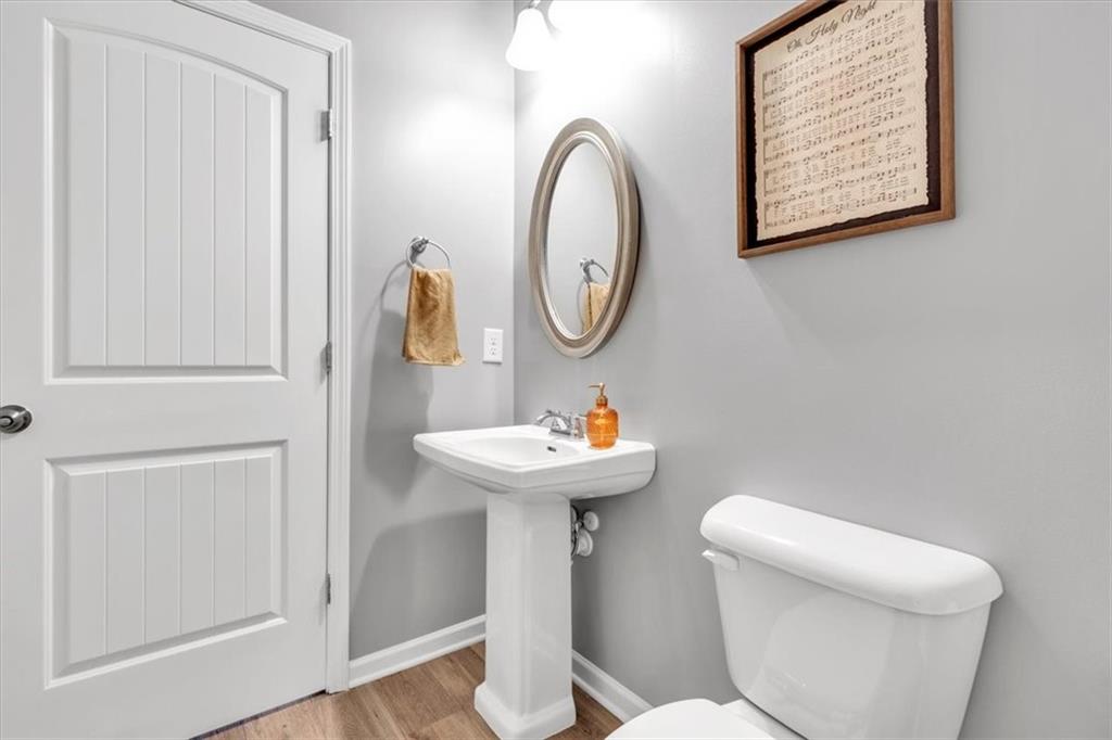 24 Jackson Farm Road Cartersville, GA 30120 - Photo 33 of 50 a bathroom with a toilet a sink and a mirror