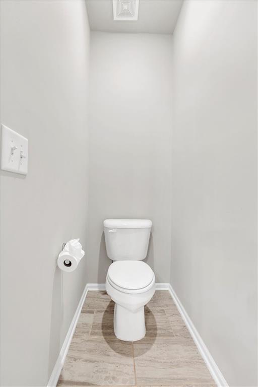 24 Jackson Farm Road Cartersville, GA 30120 - Photo 34 of 50 a white toilet sitting next to a white wall