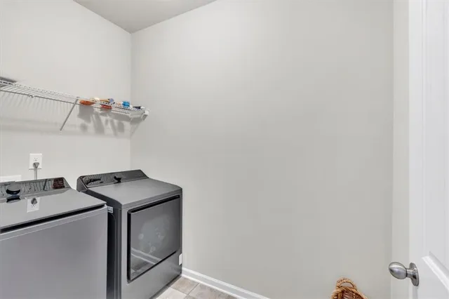 a bed room with a bed and a chair