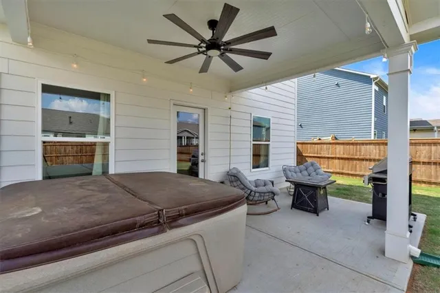 a view of a patio with couches chairs and a table