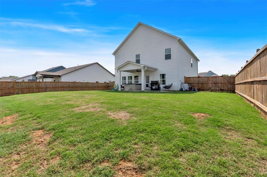 24 Jackson Farm Road Cartersville, GA 30120 - Photo 41 of 50 a view of a house with a yard and garage