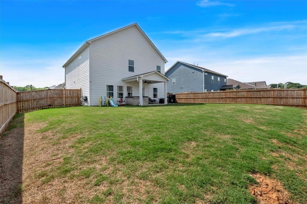 24 Jackson Farm Road Cartersville, GA 30120 - Photo 42 of 50 a view of a house with a big yard and large trees