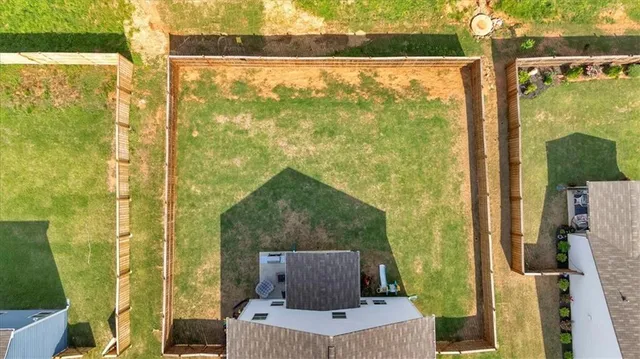 an aerial view of residential house with outdoor space and swimming pool