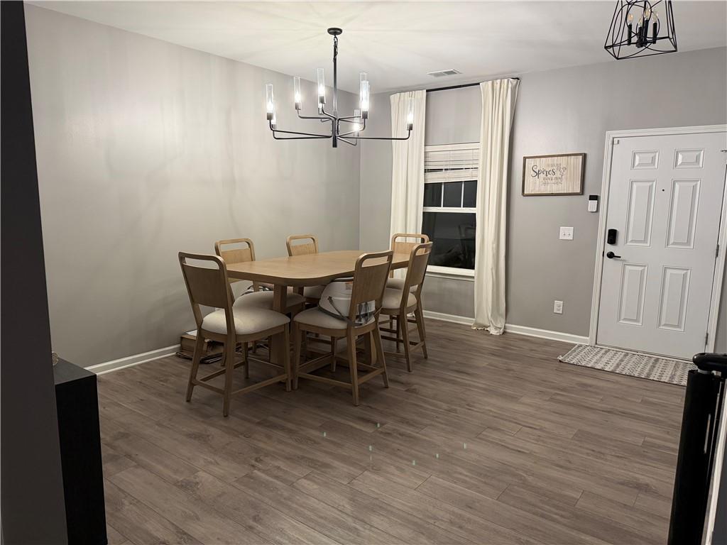 24 Jackson Farm Road Cartersville, GA 30120 - Photo 7 of 50 a view of a dining room with furniture and wooden floor