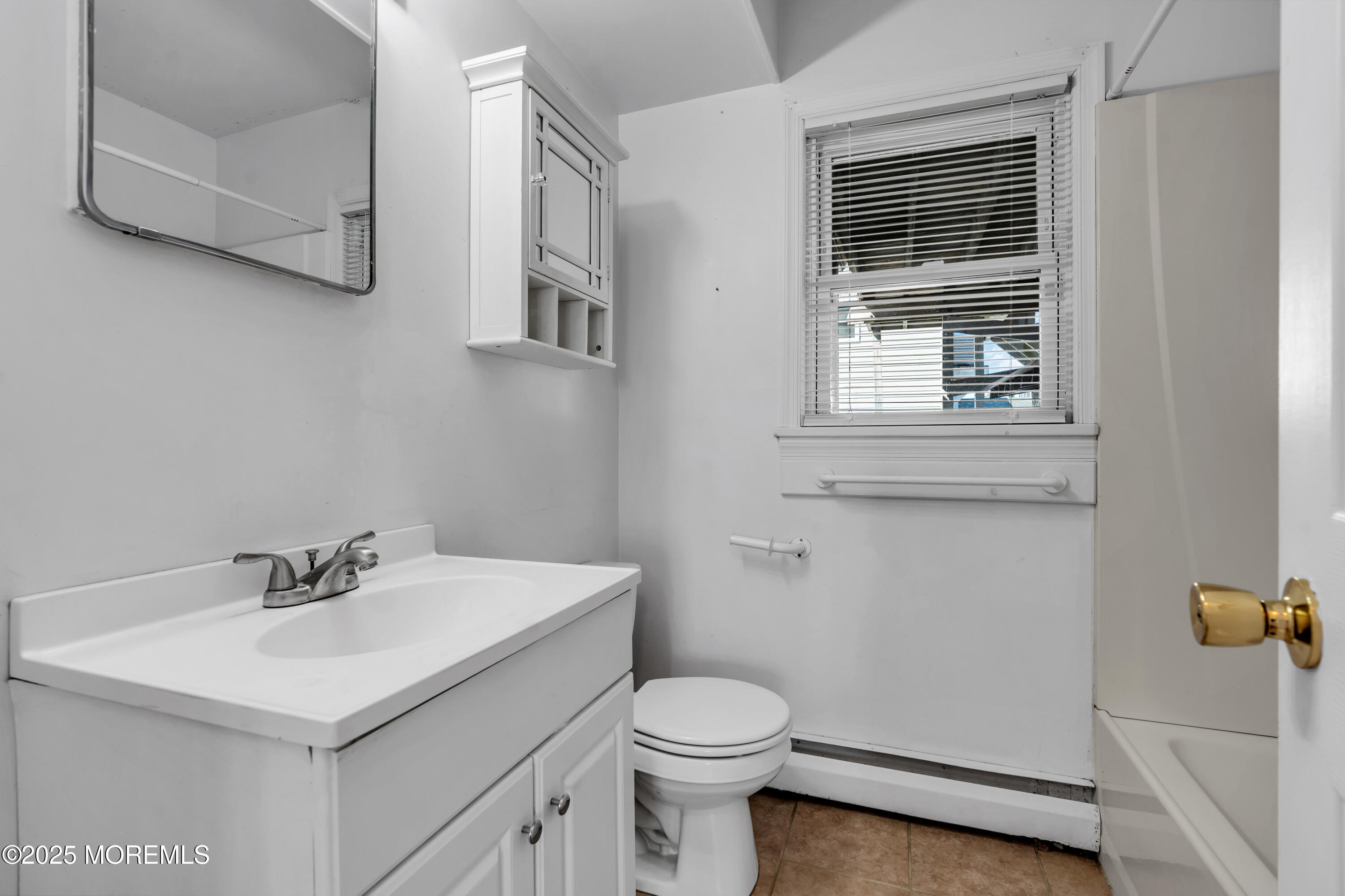 538 Front Street Union Beach, NJ 07735 - Photo 12 of 46 a bathroom with a sink toilet and vanity