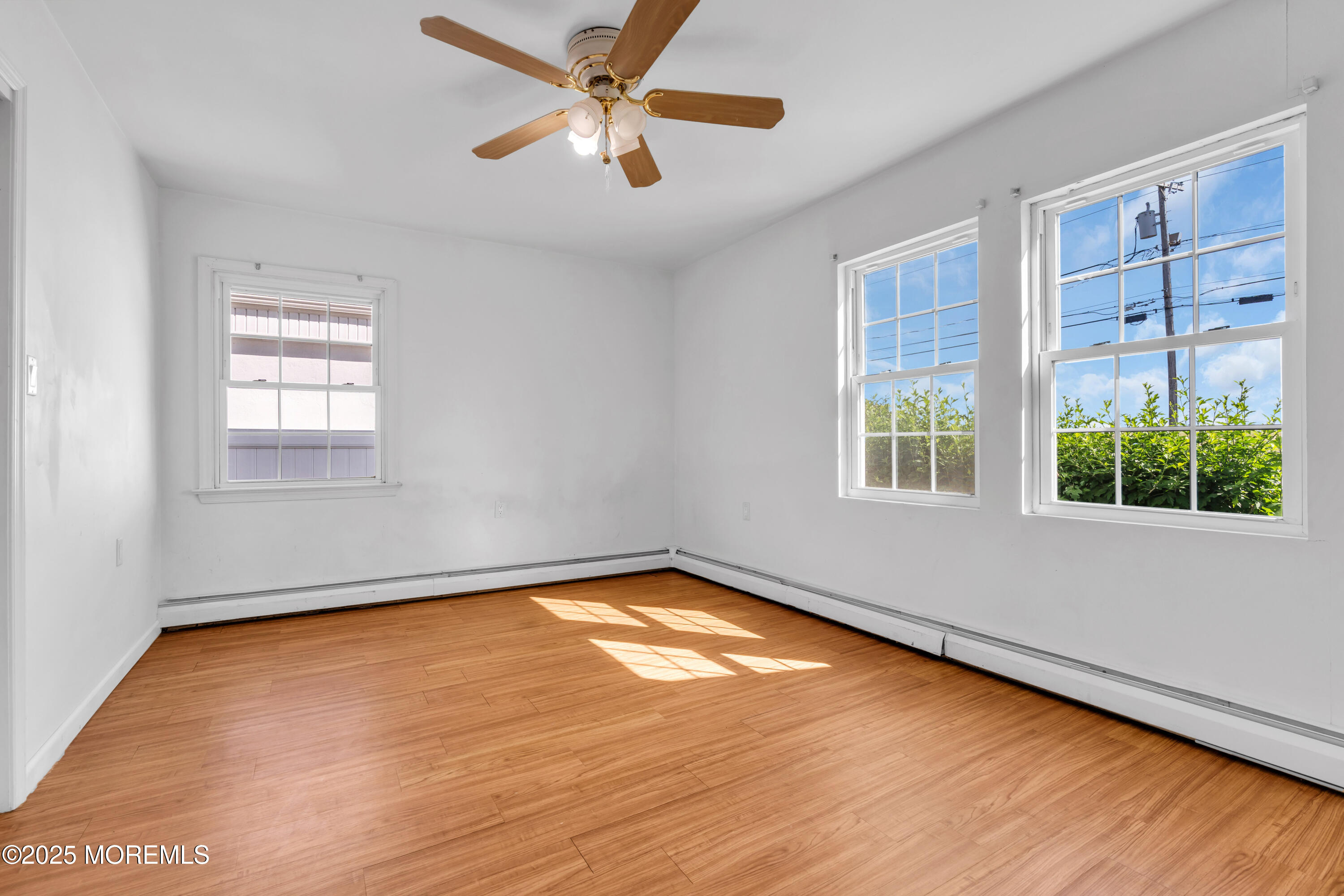 538 Front Street Union Beach, NJ 07735 - Photo 13 of 46 wooden floor in an empty room with a window