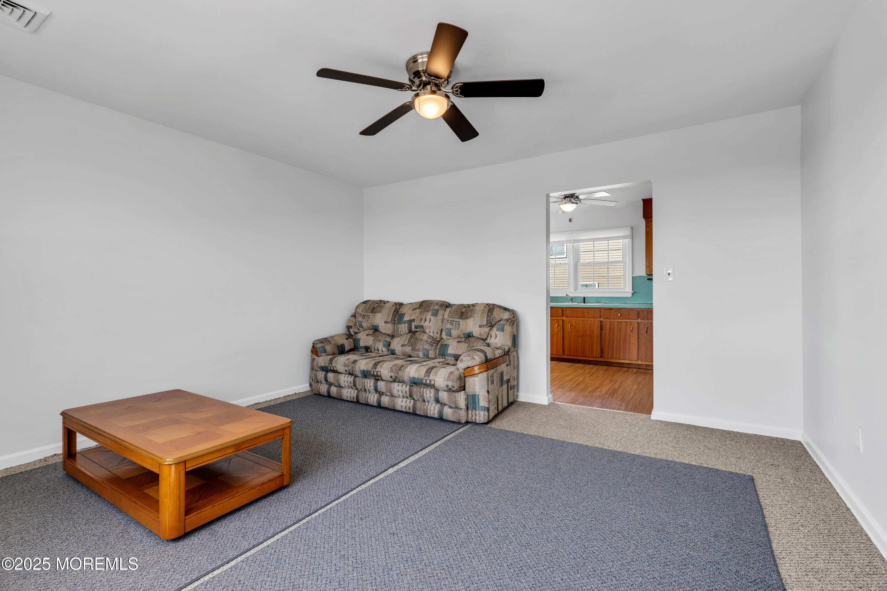 538 Front Street Union Beach, NJ 07735 - Photo 19 of 46 a living room with furniture and a chandelier