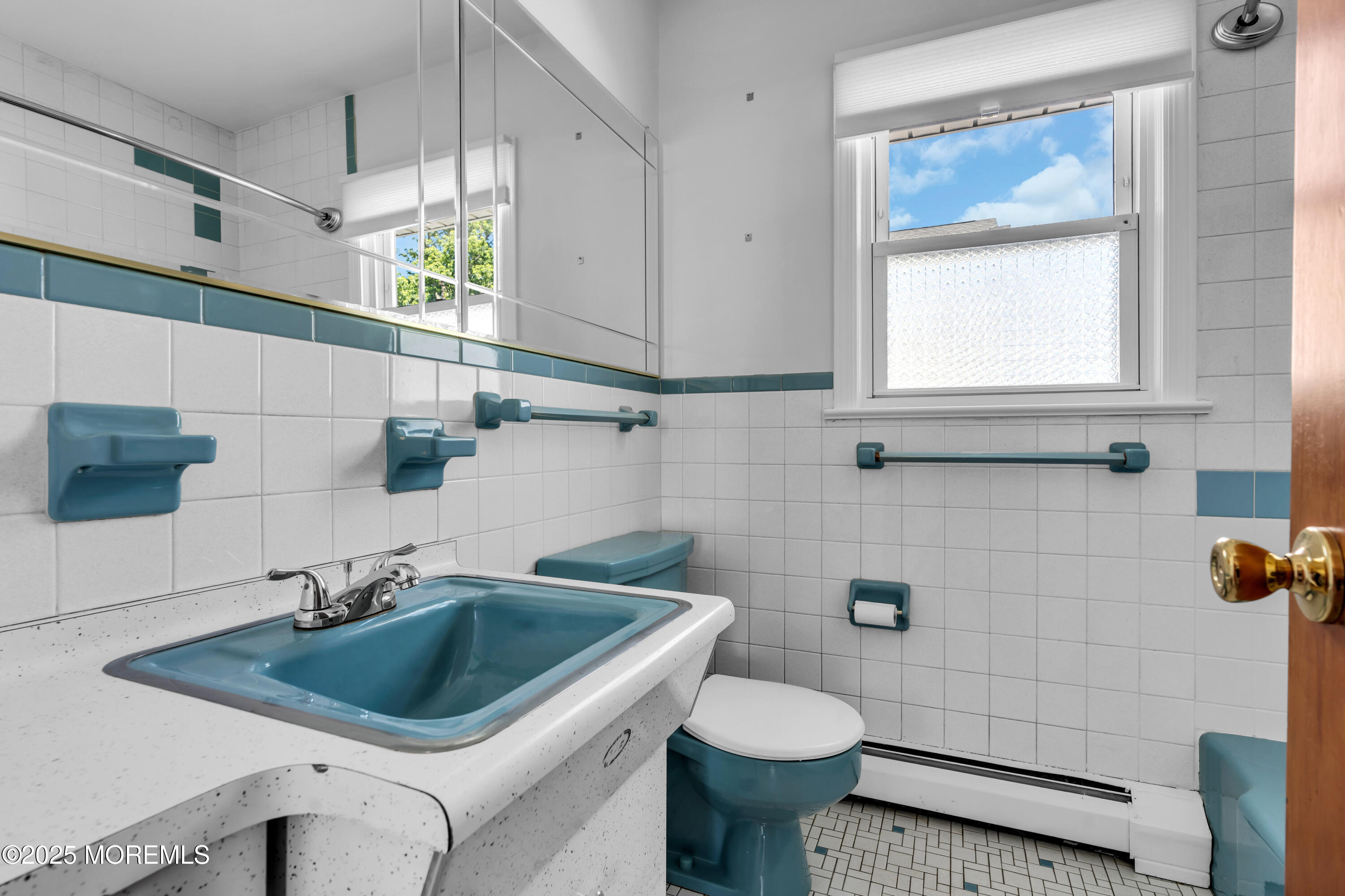 538 Front Street Union Beach, NJ 07735 - Photo 23 of 46 a bathroom with a sink a toilet and mirror