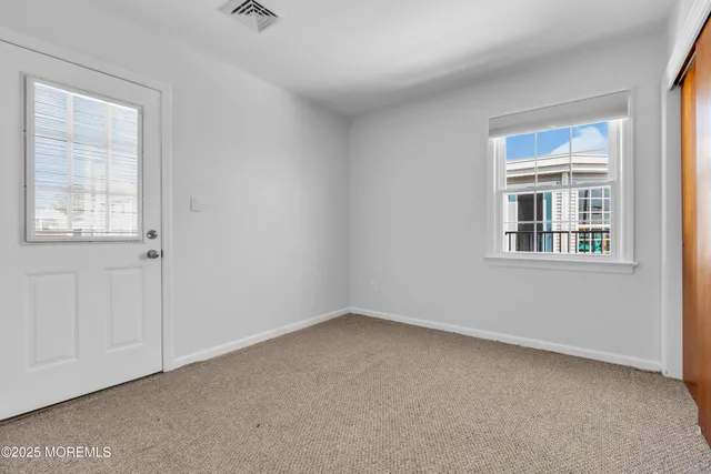 a view of a house with wooden deck
