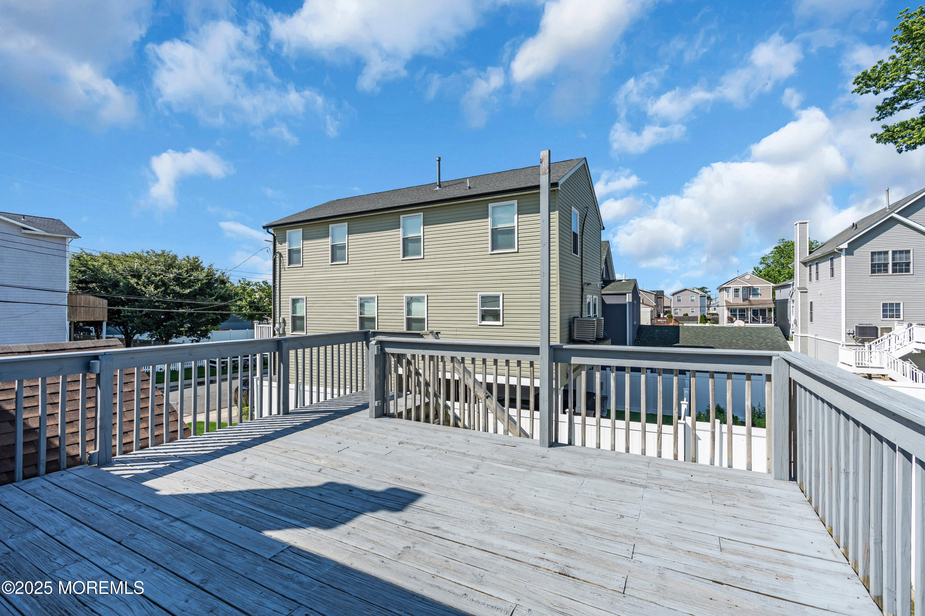 538 Front Street Union Beach, NJ 07735 - Photo 29 of 46 a view of a wooden deck with a yard