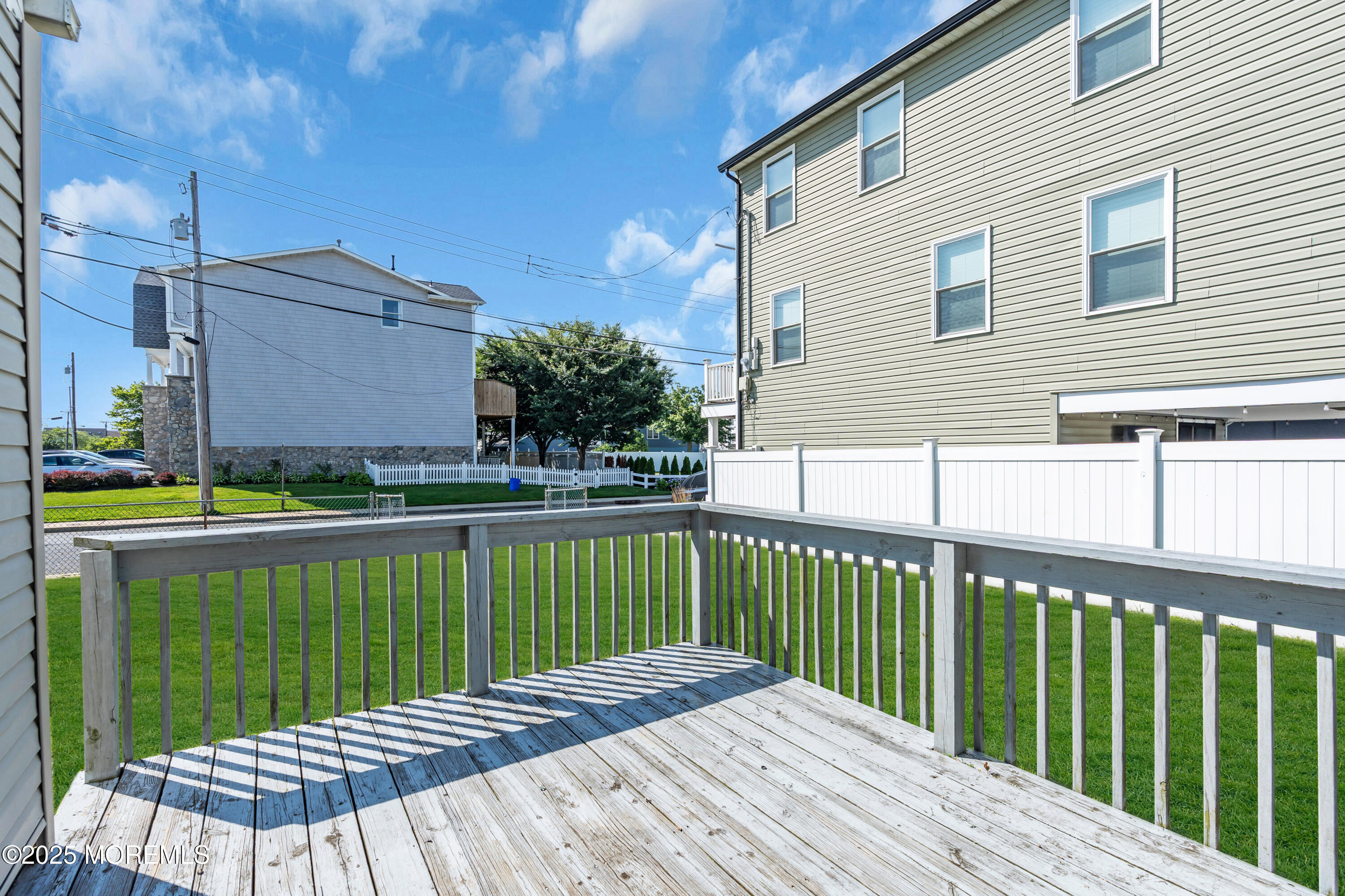 538 Front Street Union Beach, NJ 07735 - Photo 32 of 46 a view of a wooden deck with a yard