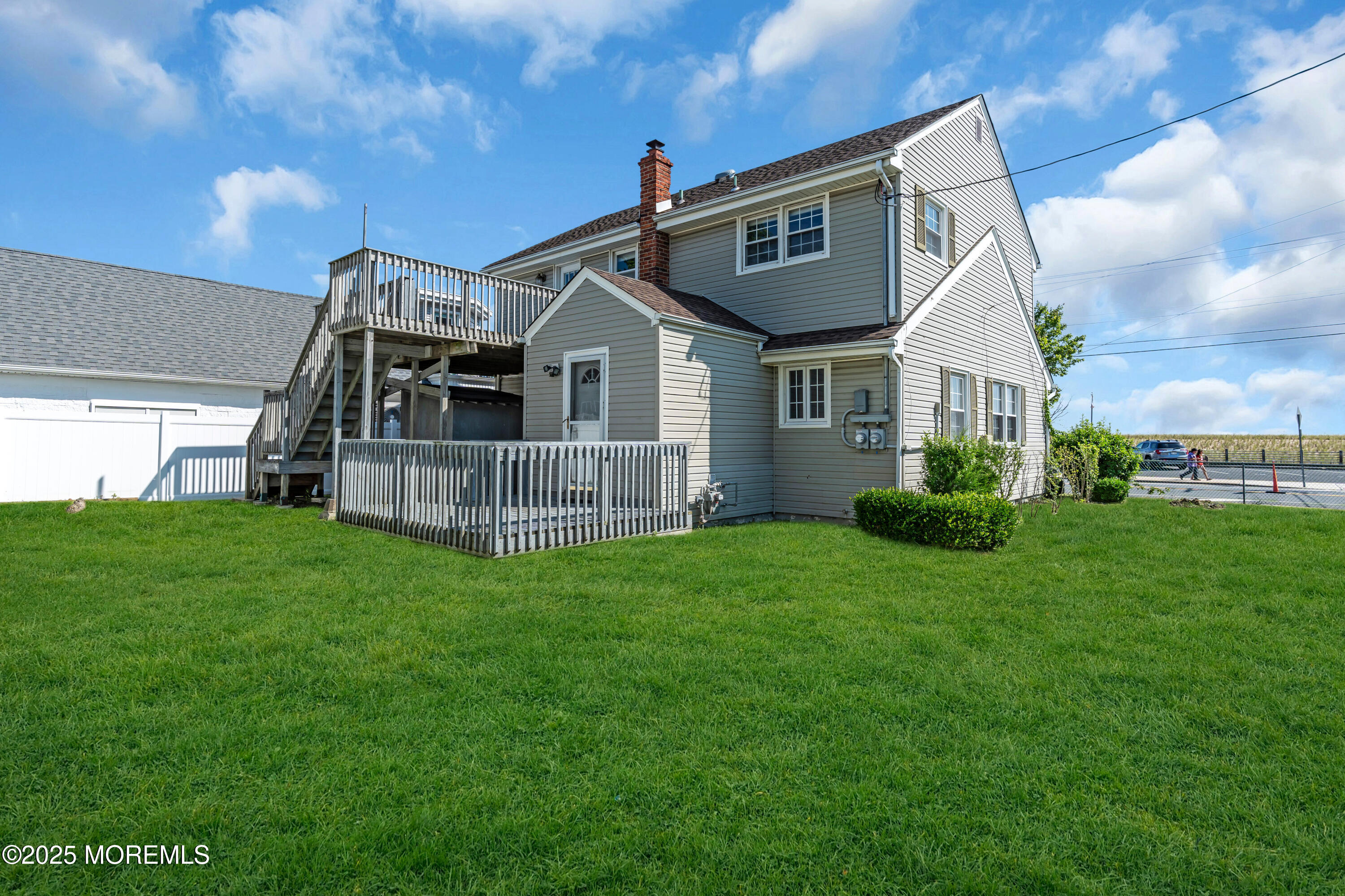 538 Front Street Union Beach, NJ 07735 - Photo 33 of 46 a view of a big house with a big yard and large trees