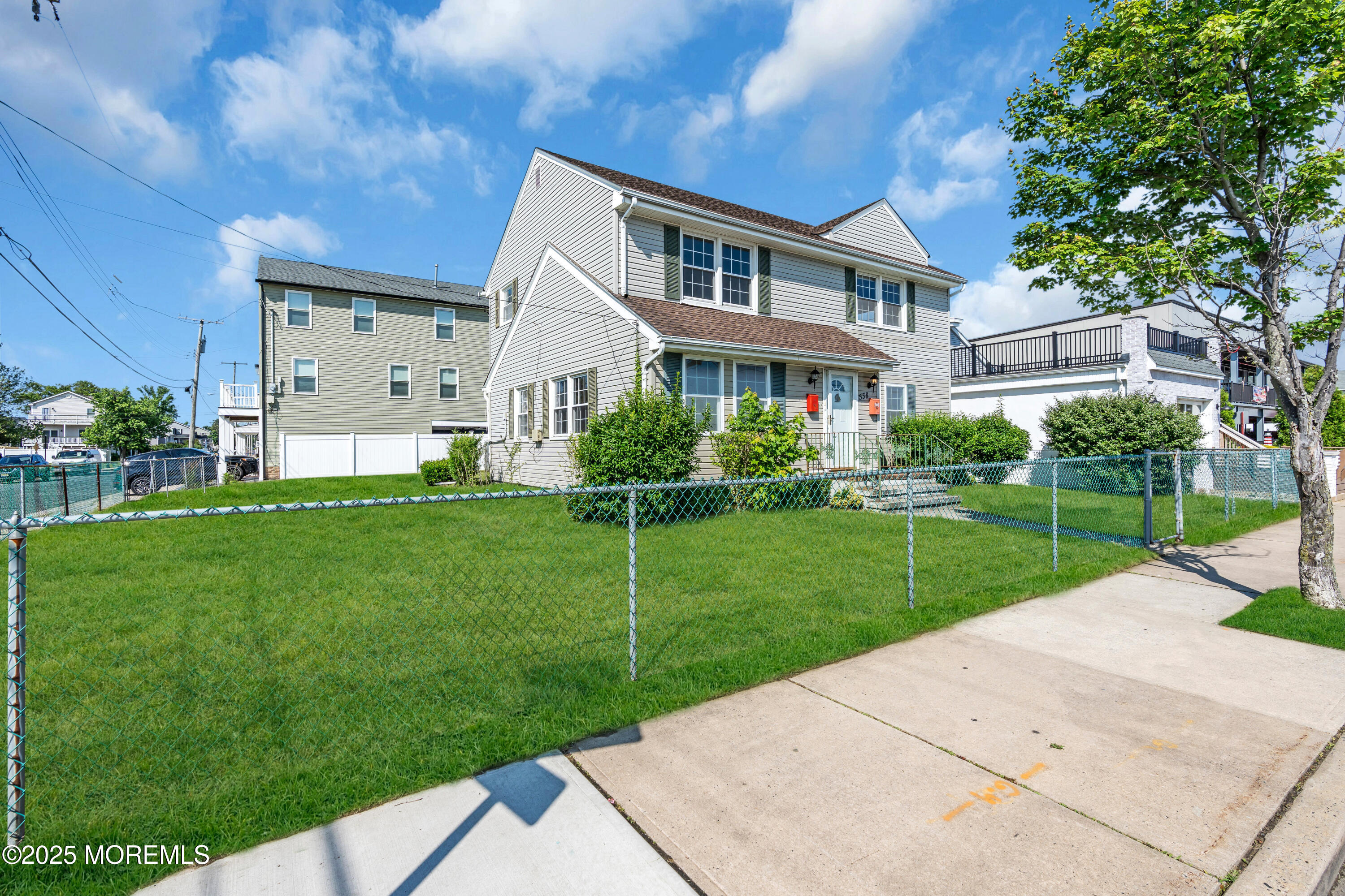 538 Front Street Union Beach, NJ 07735 - Photo 43 of 46 a front view of house with yard and green space