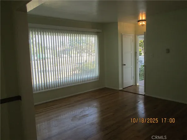 a kitchen with granite countertop white cabinets and a sink