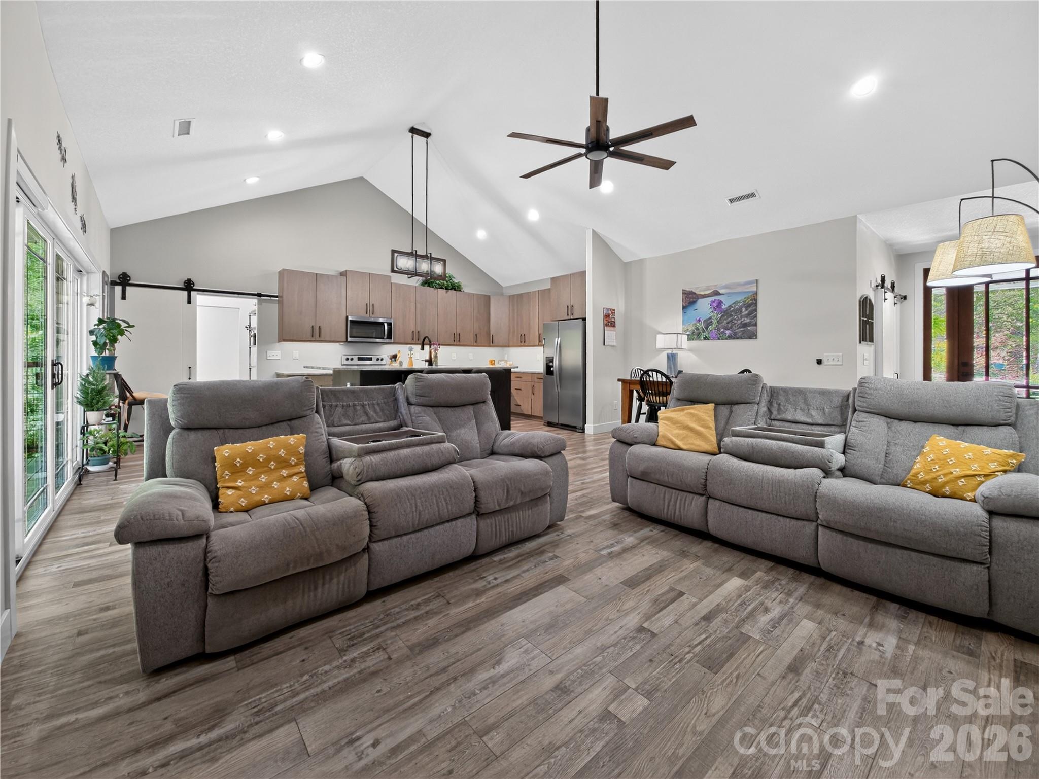 278 Hunters Trace Rutherfordton, NC 28139 - Photo 19 of 33 a living room with furniture kitchen view and a chandelier