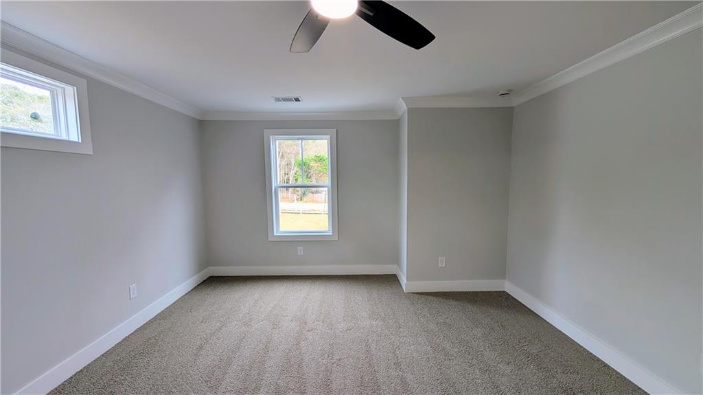 1706 Cunningham Road Southwest Marietta, GA 30008 - Photo 25 of 27 wooden floor in an empty room with a window