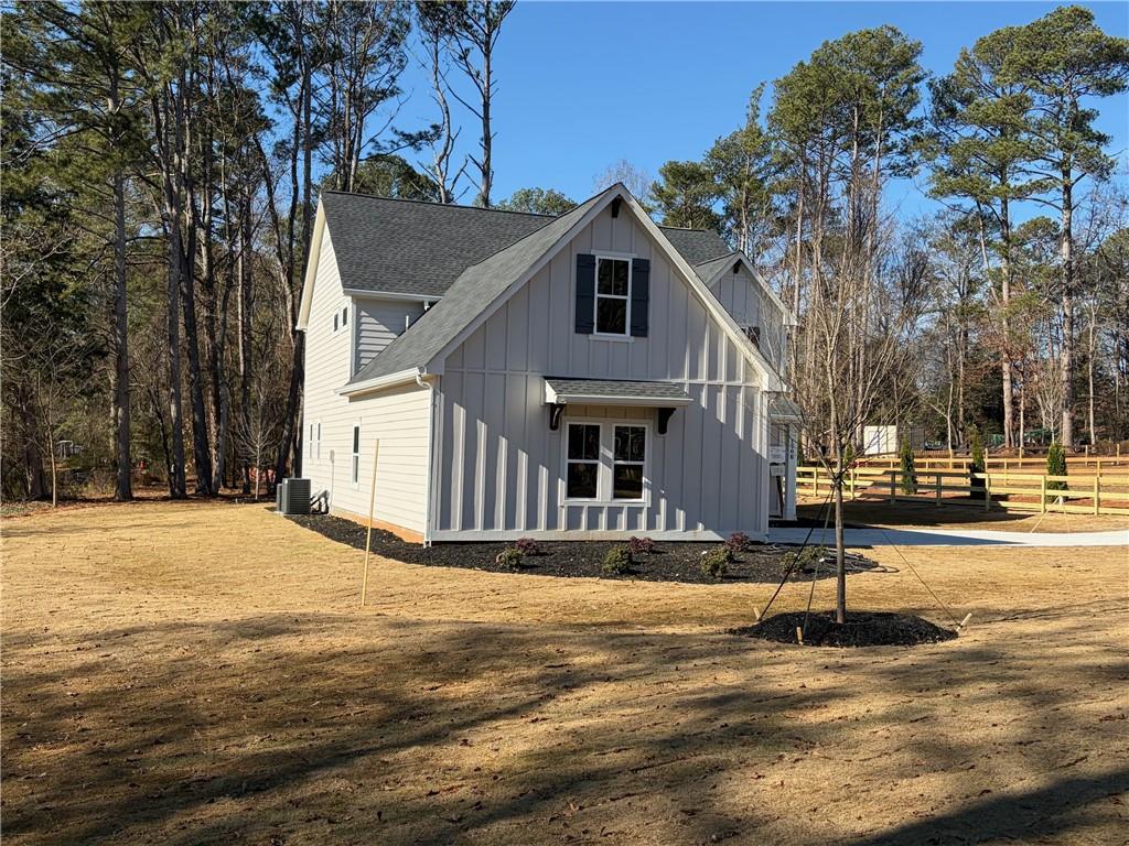 1706 Cunningham Road Southwest Marietta, GA 30008 - Photo 5 of 27 a view of a house with snow on the road