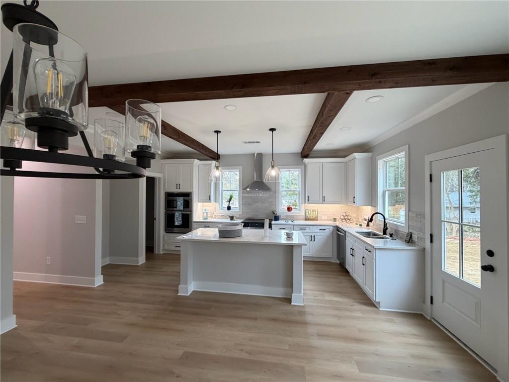 1706 Cunningham Road Southwest Marietta, GA 30008 - Photo 9 of 27 a kitchen with counter top space and stainless steel appliances