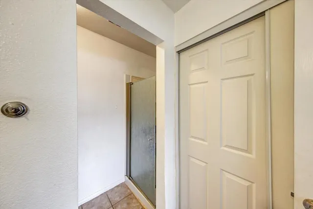 a en suite bathroom with a sink double vanity and mirror