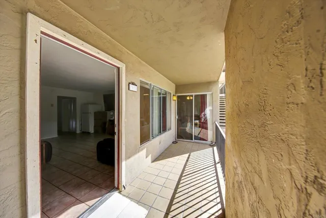 a view of a patio with table and chairs with wooden fence