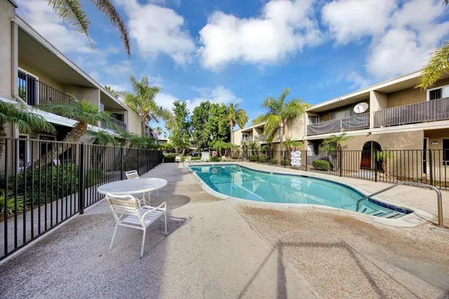 a view of a yard in front of a brick house
