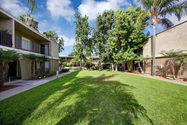 a view of a house with backyard porch and sitting area